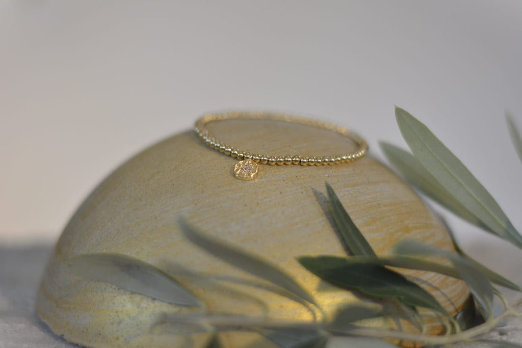Armband in gold mit Zirkoniastein - Edelstahlperlen und funkelnden Anhänger